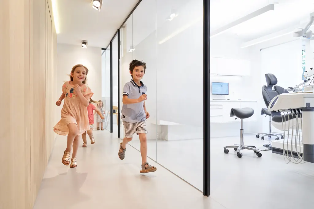 Children running happily through the practice